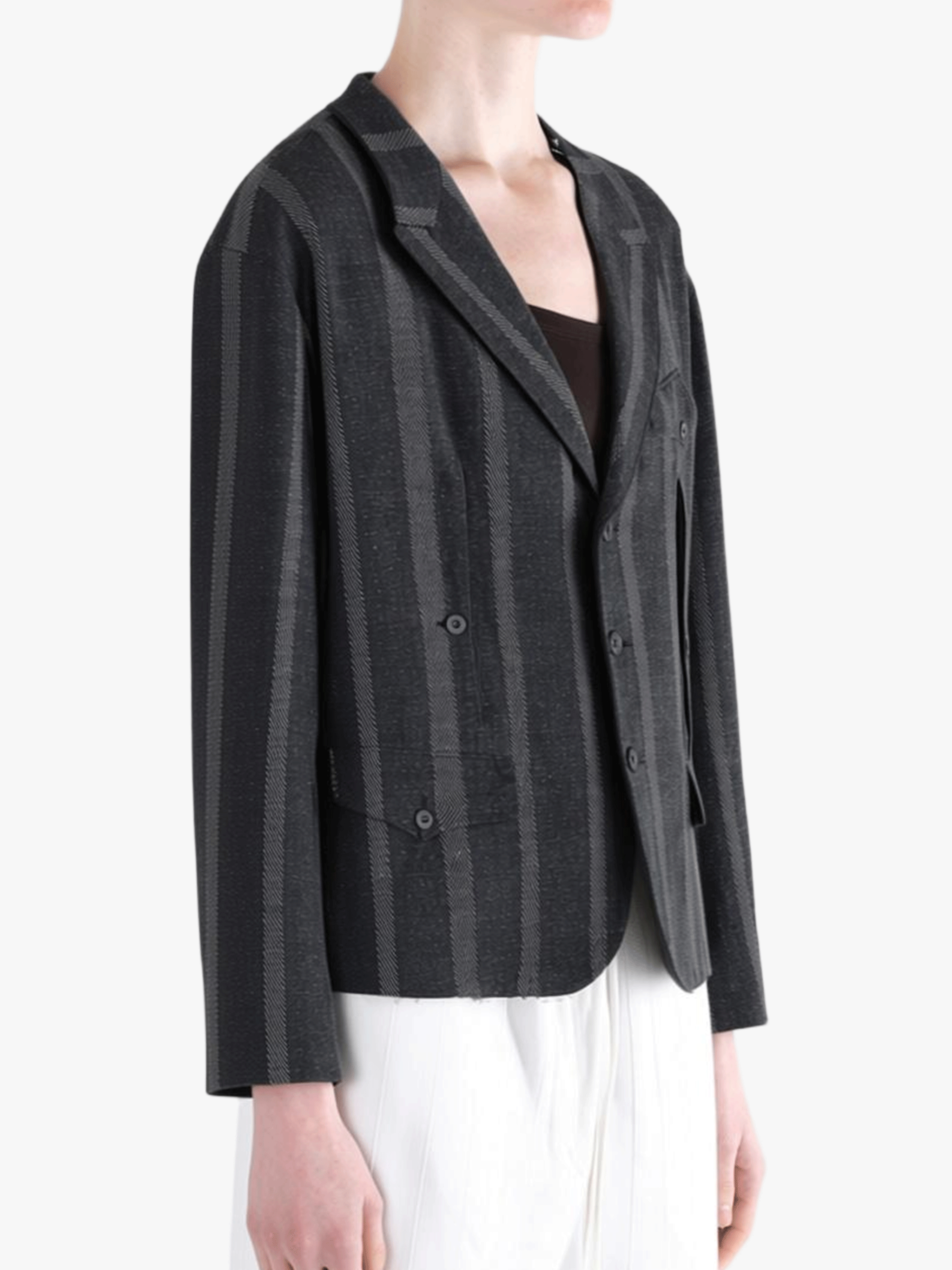 Black jacket-coat worn by a person, showing the jacket-coat's fit