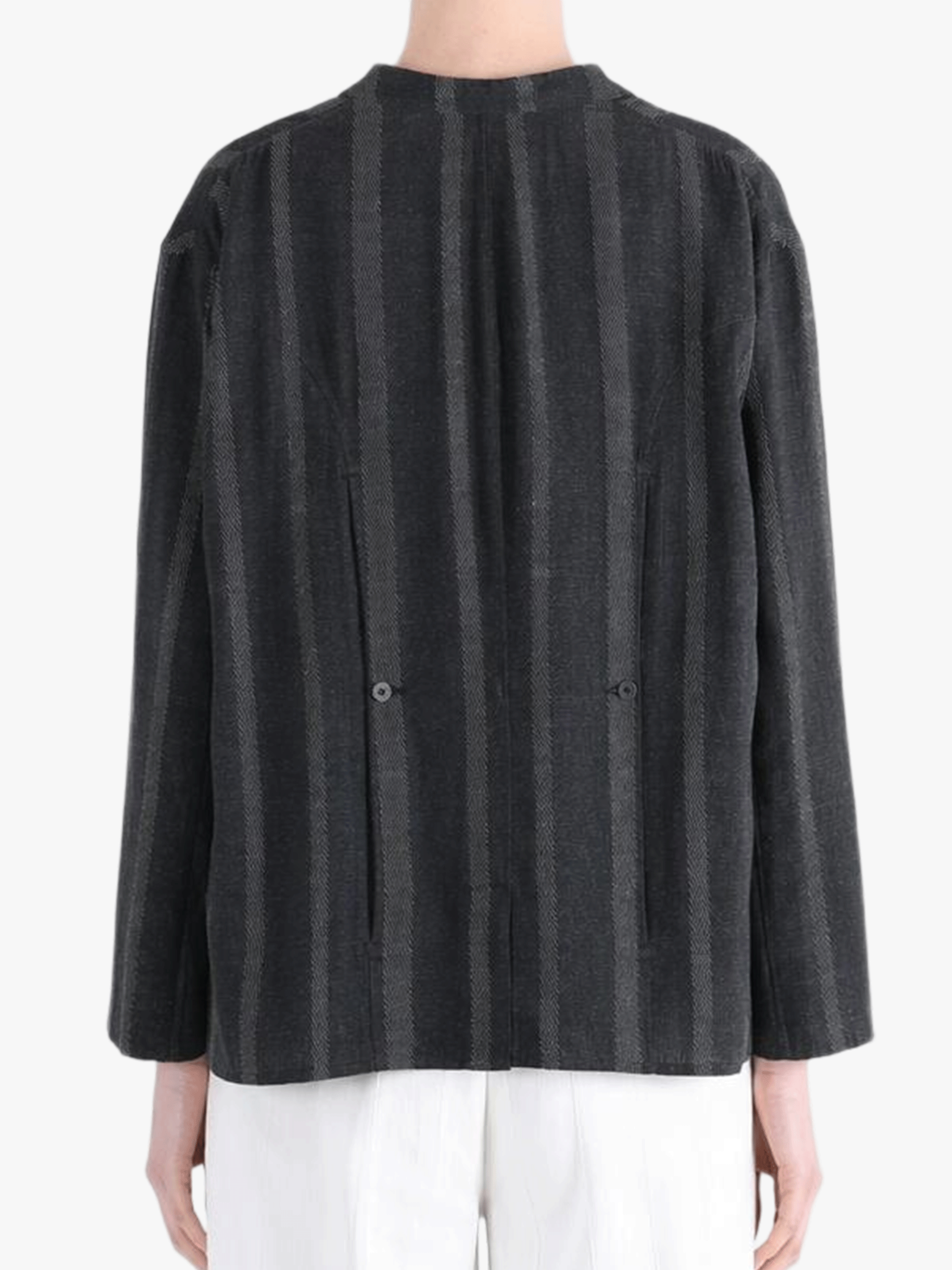 Black jacket-coat worn by a person, showing the jacket-coat's fit
