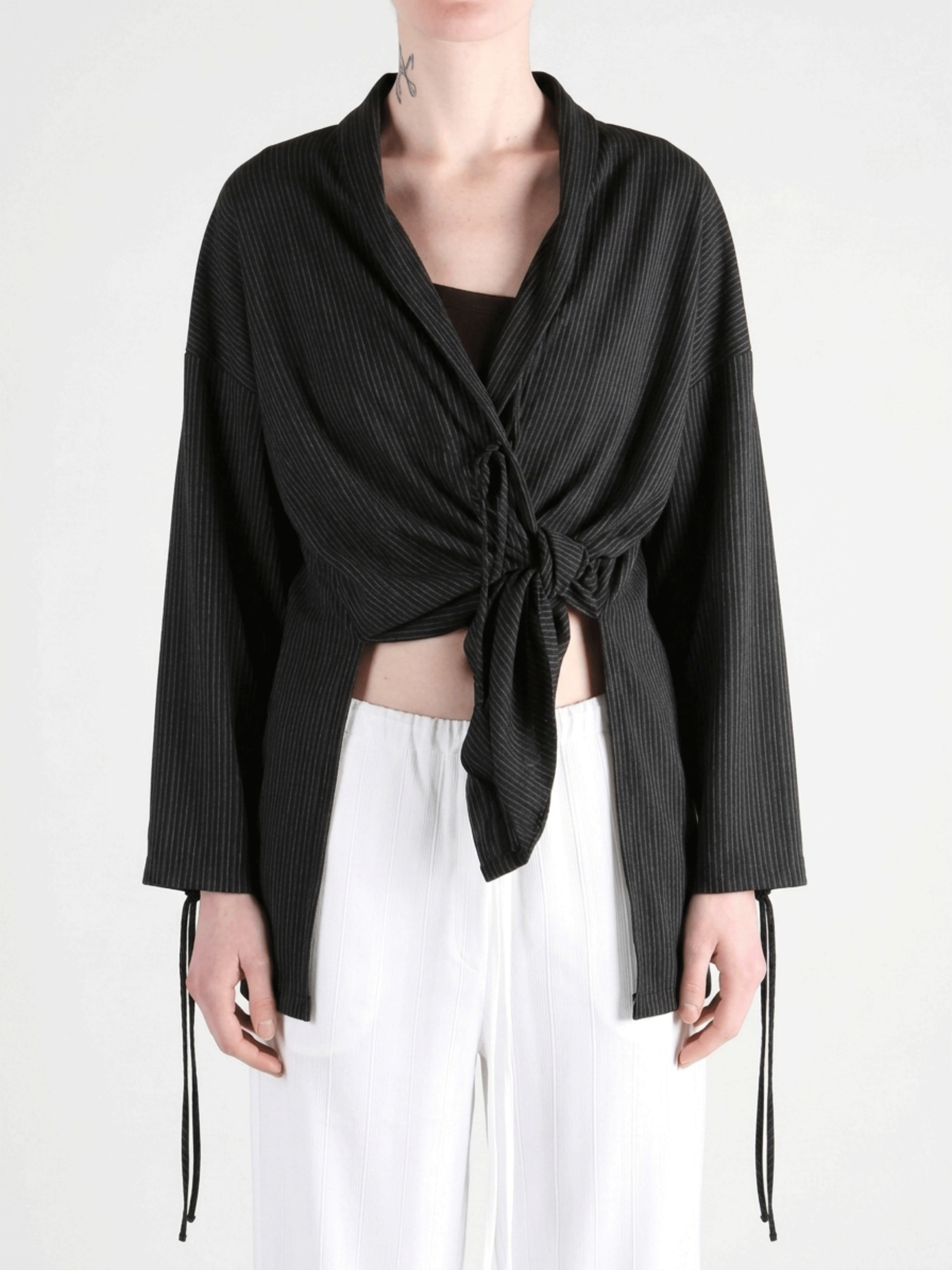 Black jackets worn by a person,showing the jackets fit