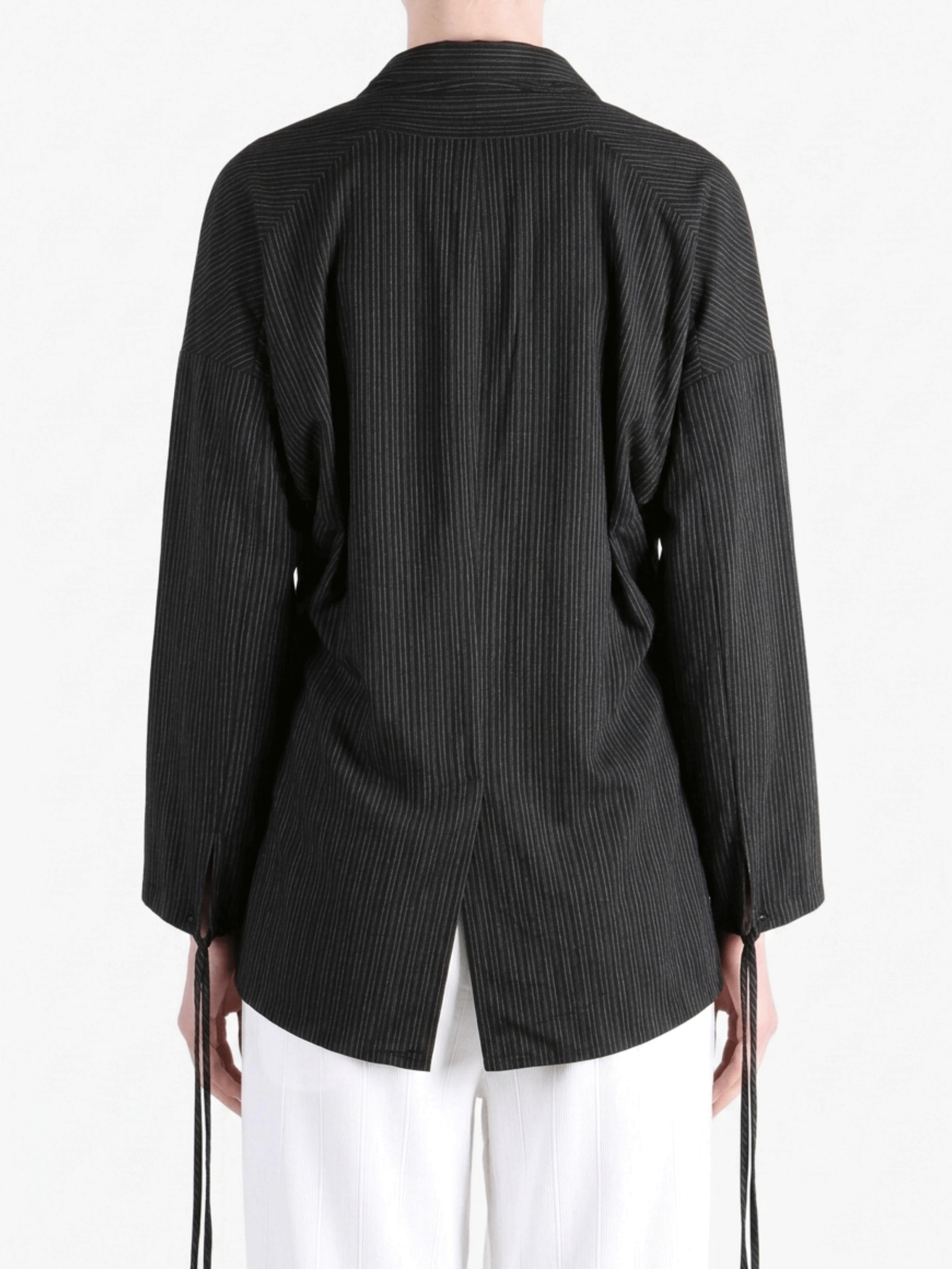 Black jackets worn by a person,showing the jackets fit