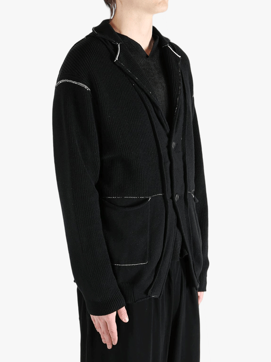 Black jacket worn by a person, showing the jacket's fit