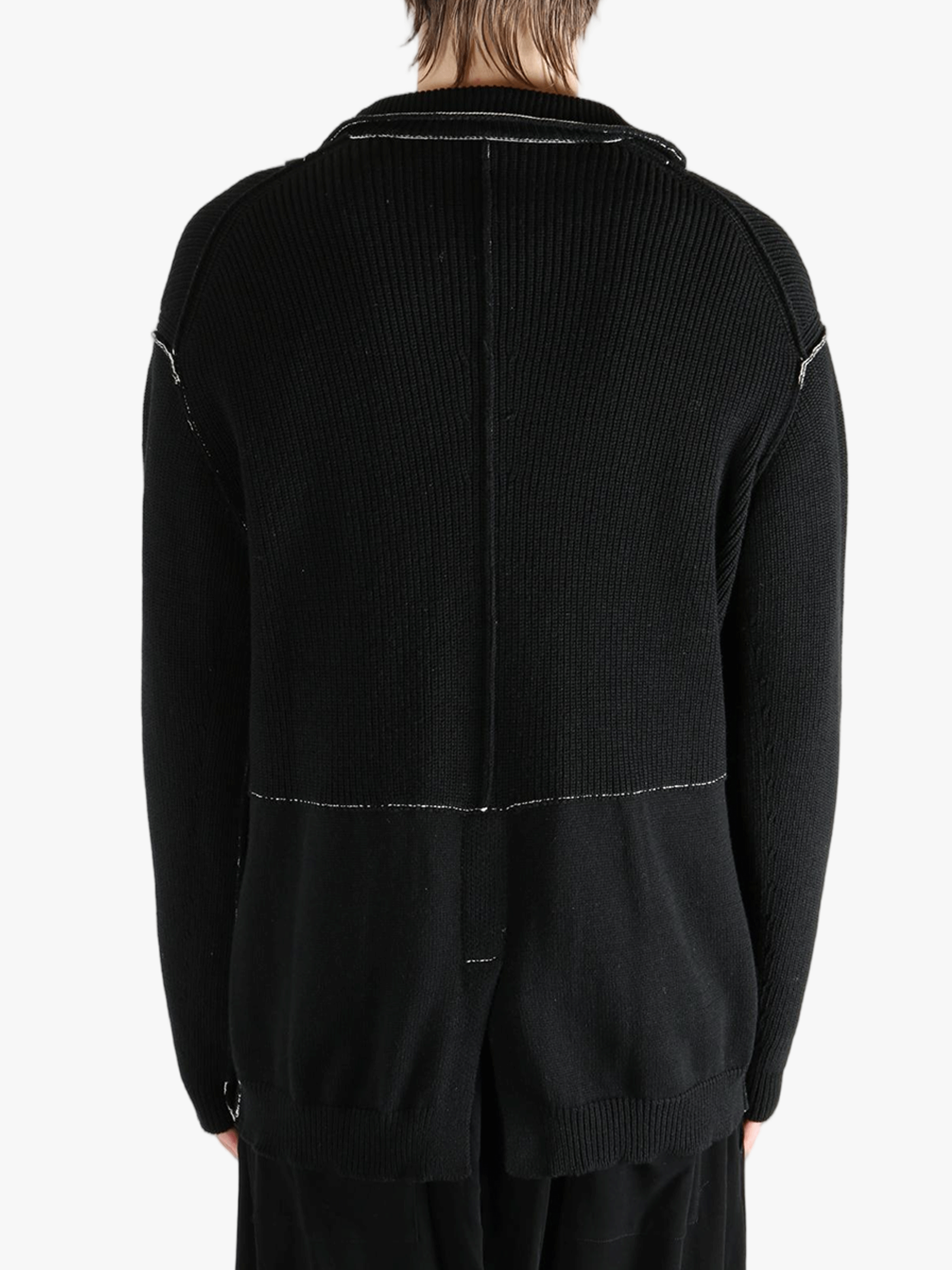 Black jacket worn by a person, showing the jacket's fit