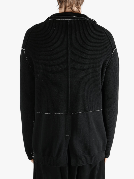 Black jacket worn by a person, showing the jacket's fit