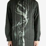 Black jacket worn by a person, showing the black's fit