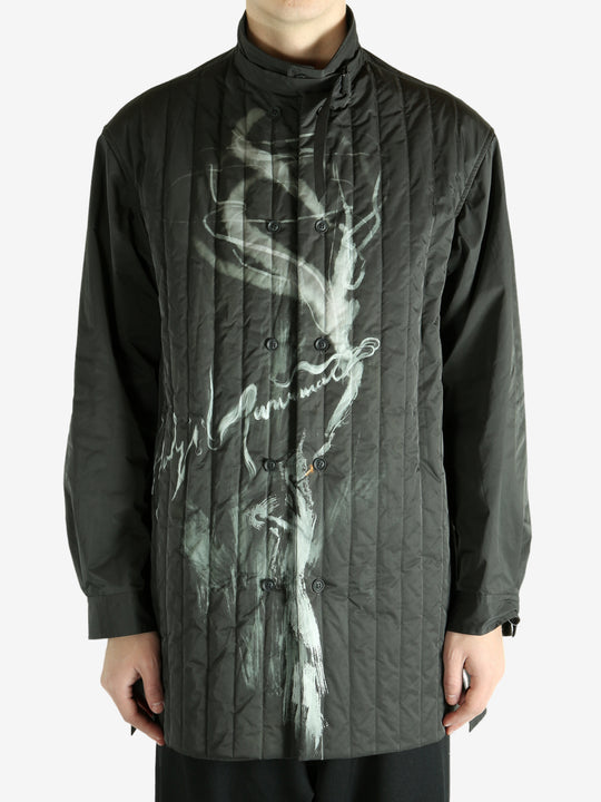 Black jacket worn by a person, showing the black's fit