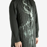 Black jacket worn by a person, showing the black's fit