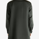 Black jacket worn by a person, showing the black's fit