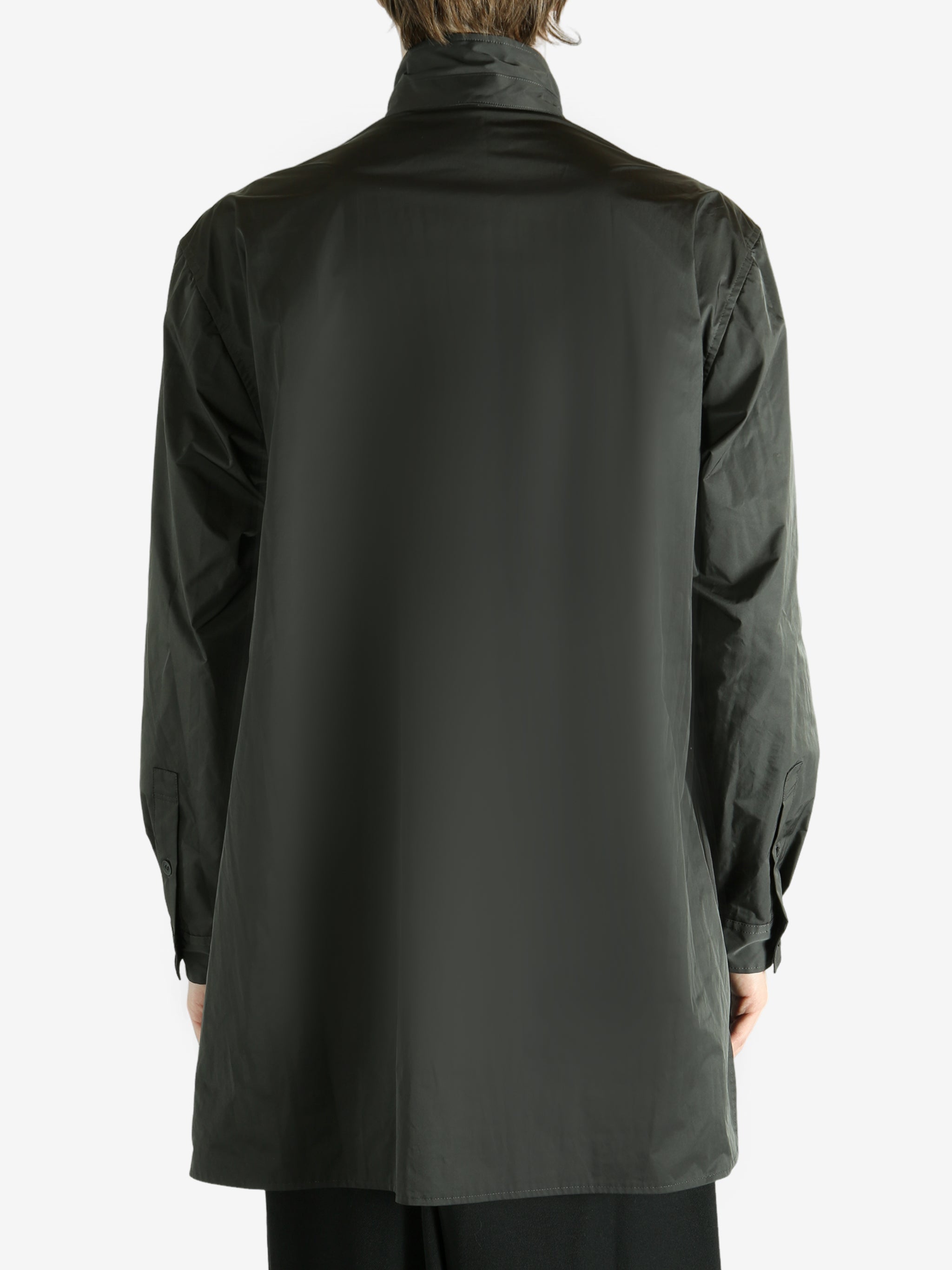 Black jacket worn by a person, showing the black's fit