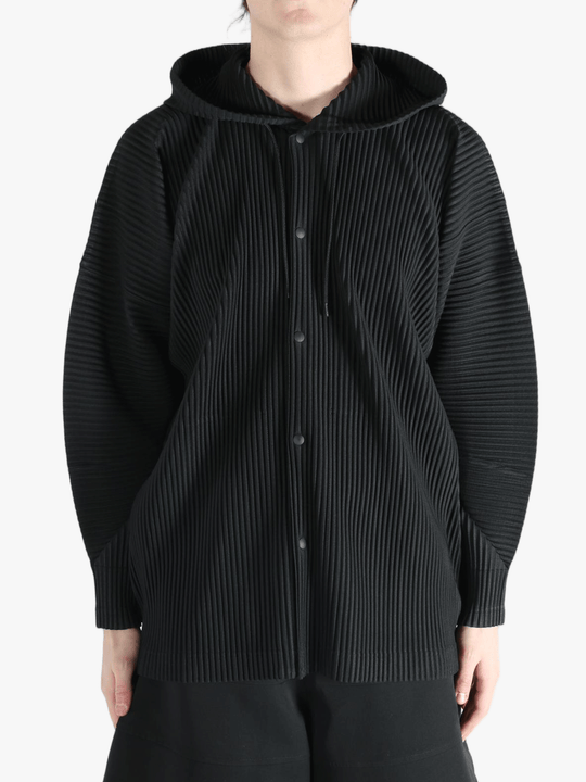 Black jacket worn by a person, showing the jacket's fit