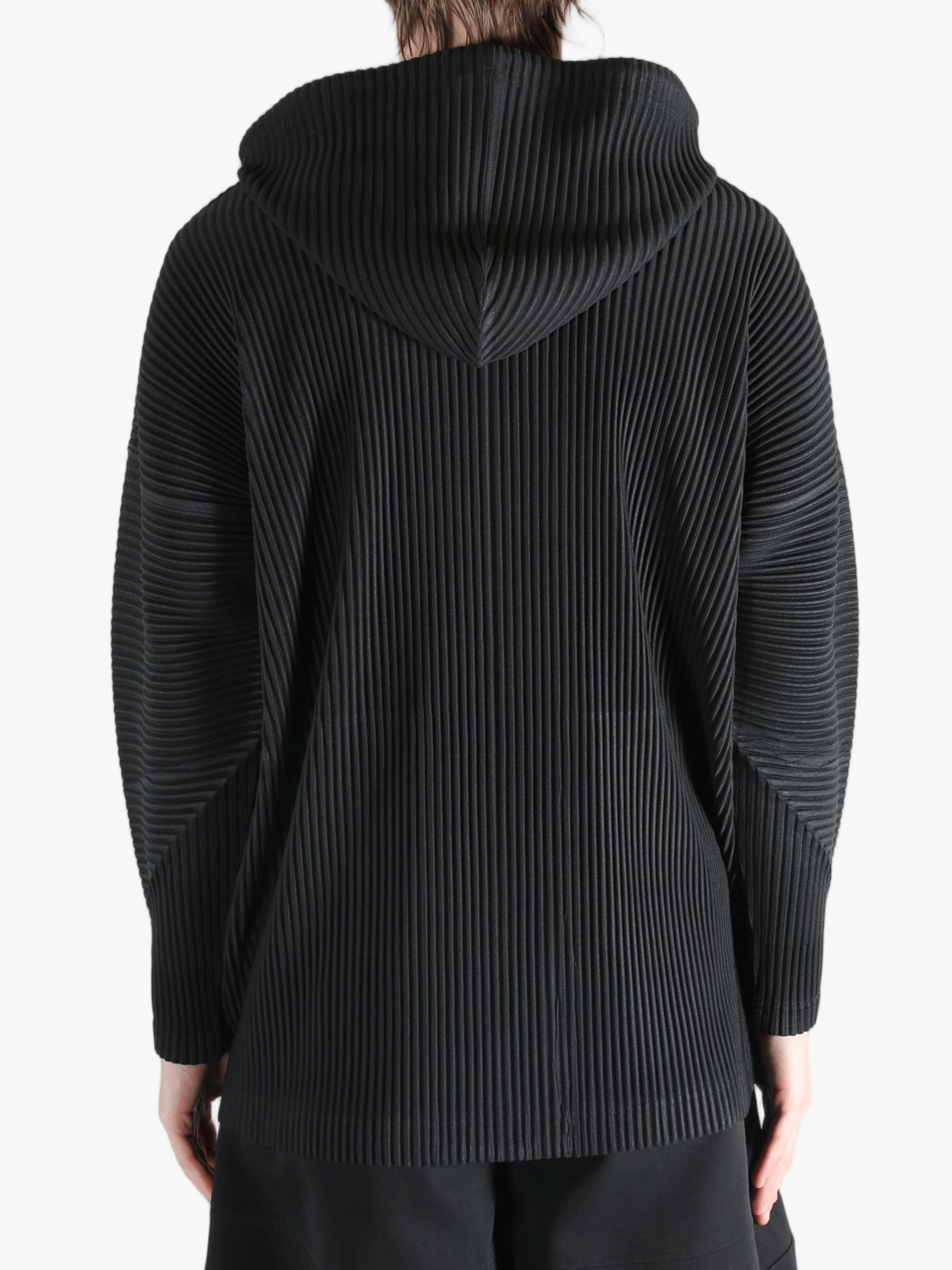 Black jacket worn by a person, showing the jacket's fit