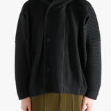 Black blouson worn by a person, showing the blouson's fit