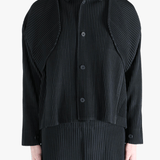 Black top worn by a person, showing the top fit