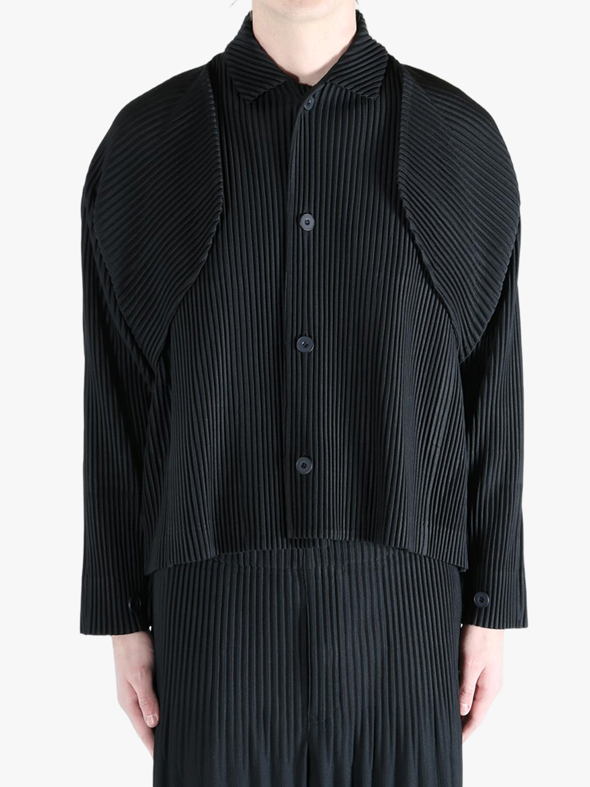 Black top worn by a person, showing the top fit