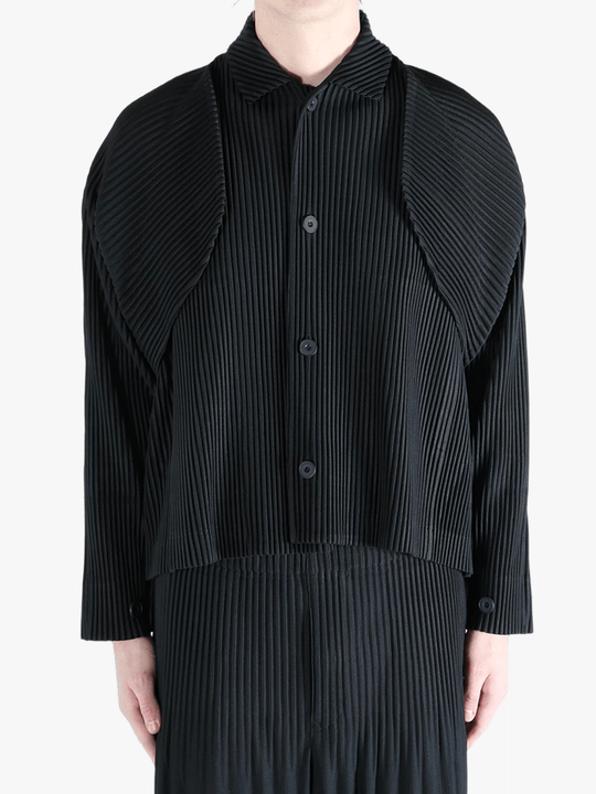 Black top worn by a person, showing the top fit