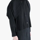 Black top worn by a person, showing the top fit