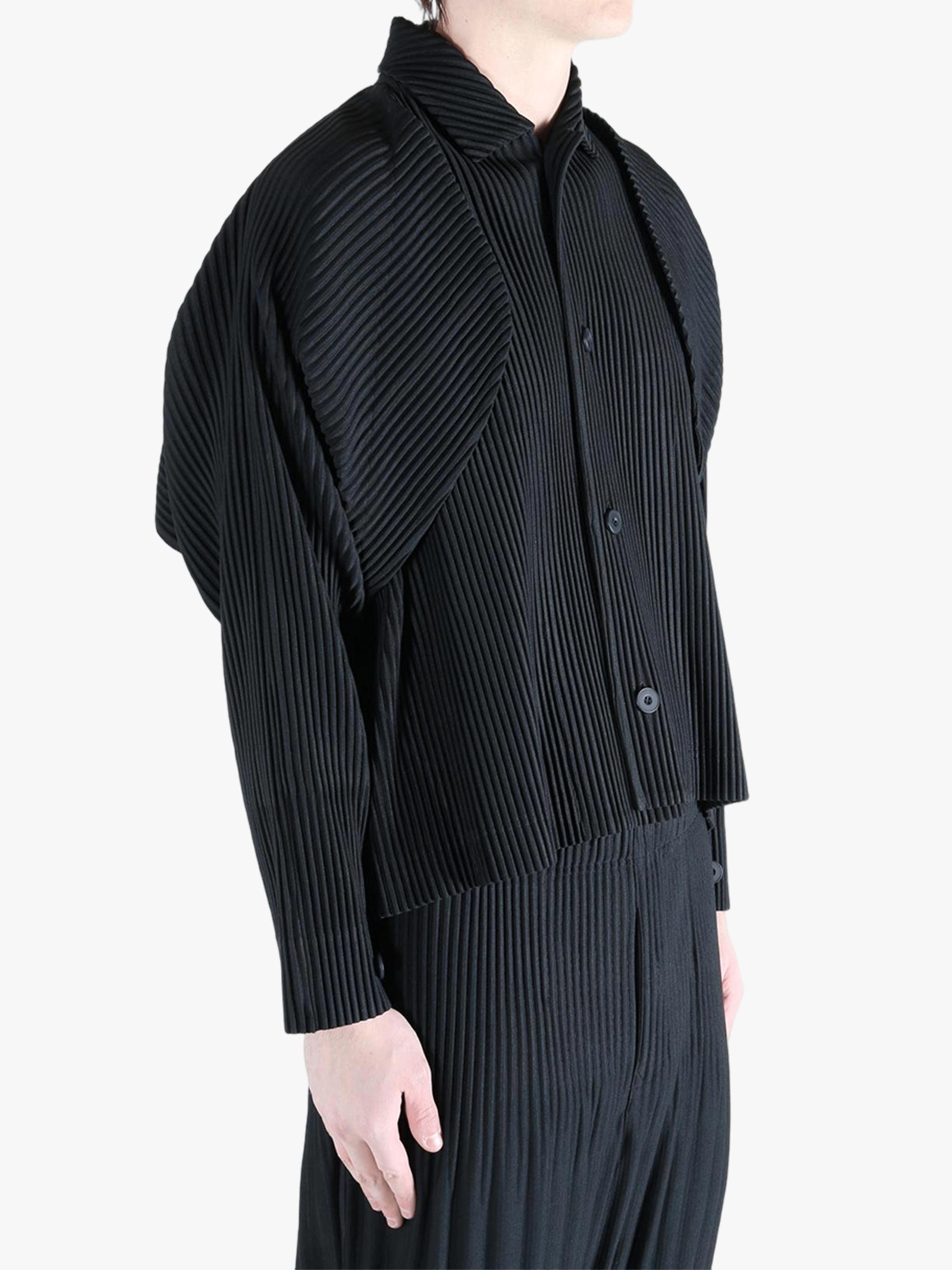 Black top worn by a person, showing the top fit