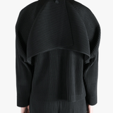 Black top worn by a person, showing the top fit