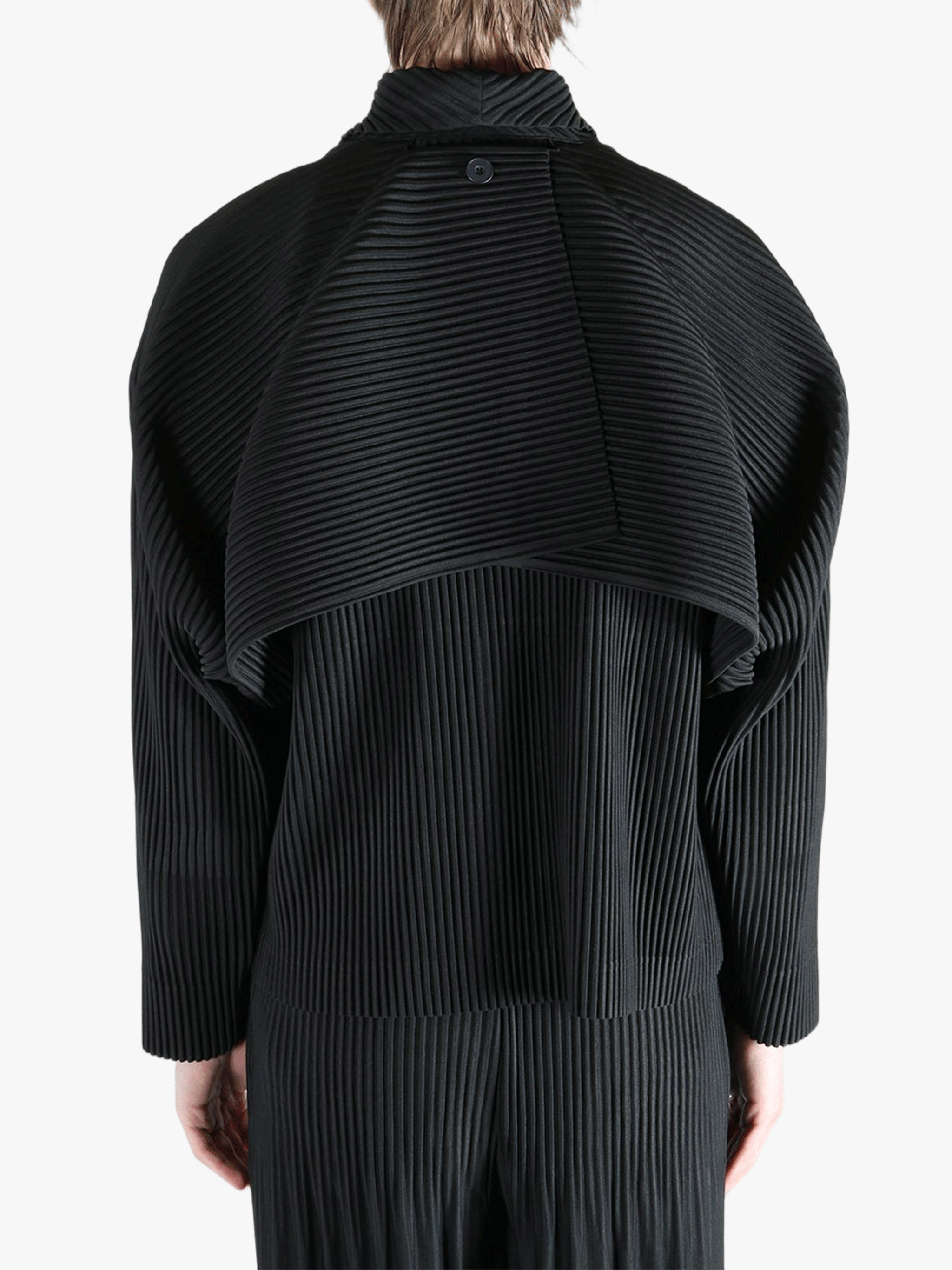 Black top worn by a person, showing the top fit