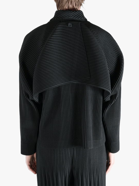 Black top worn by a person, showing the top fit