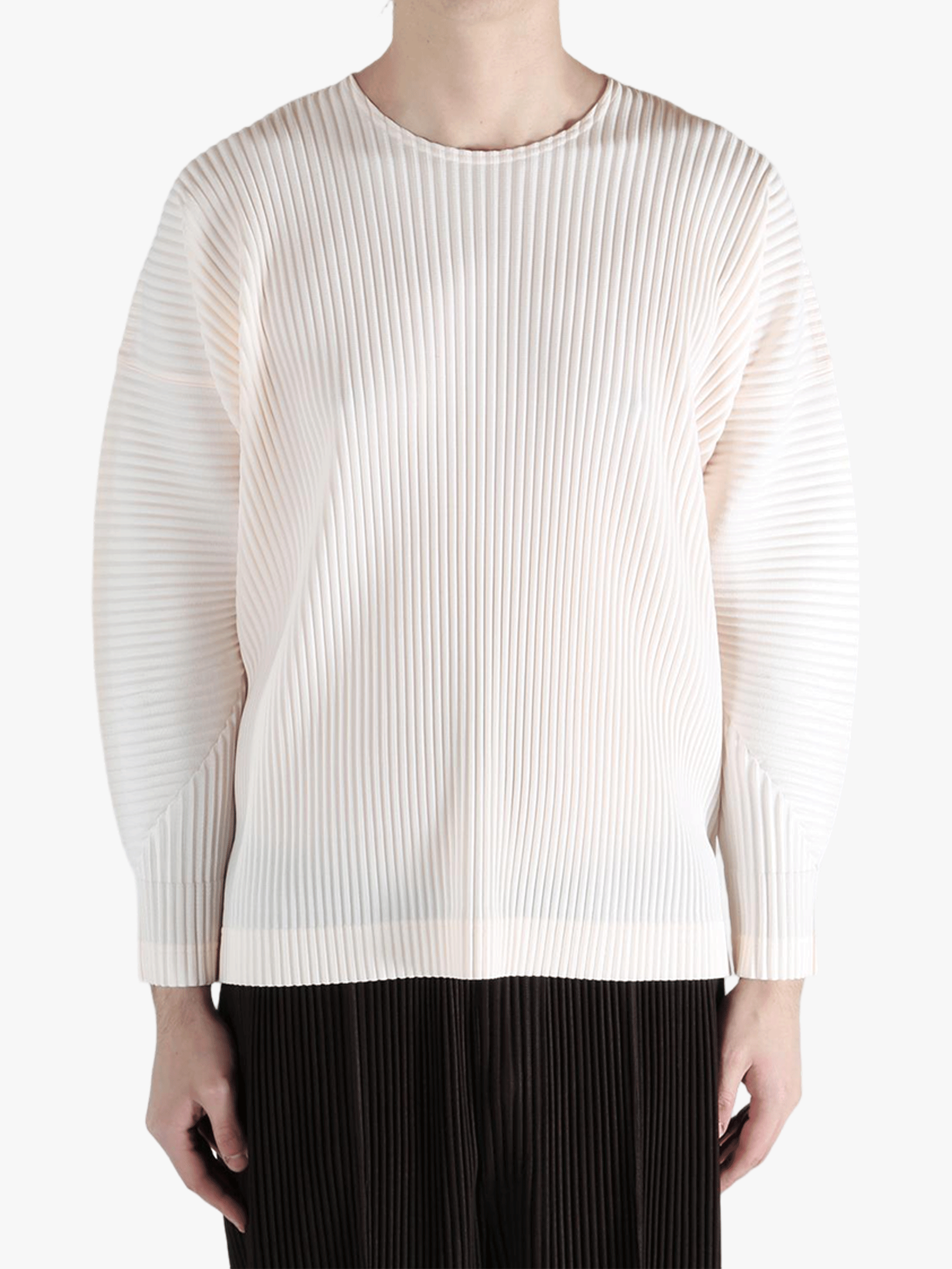 White top worn by a person,showing the top fit