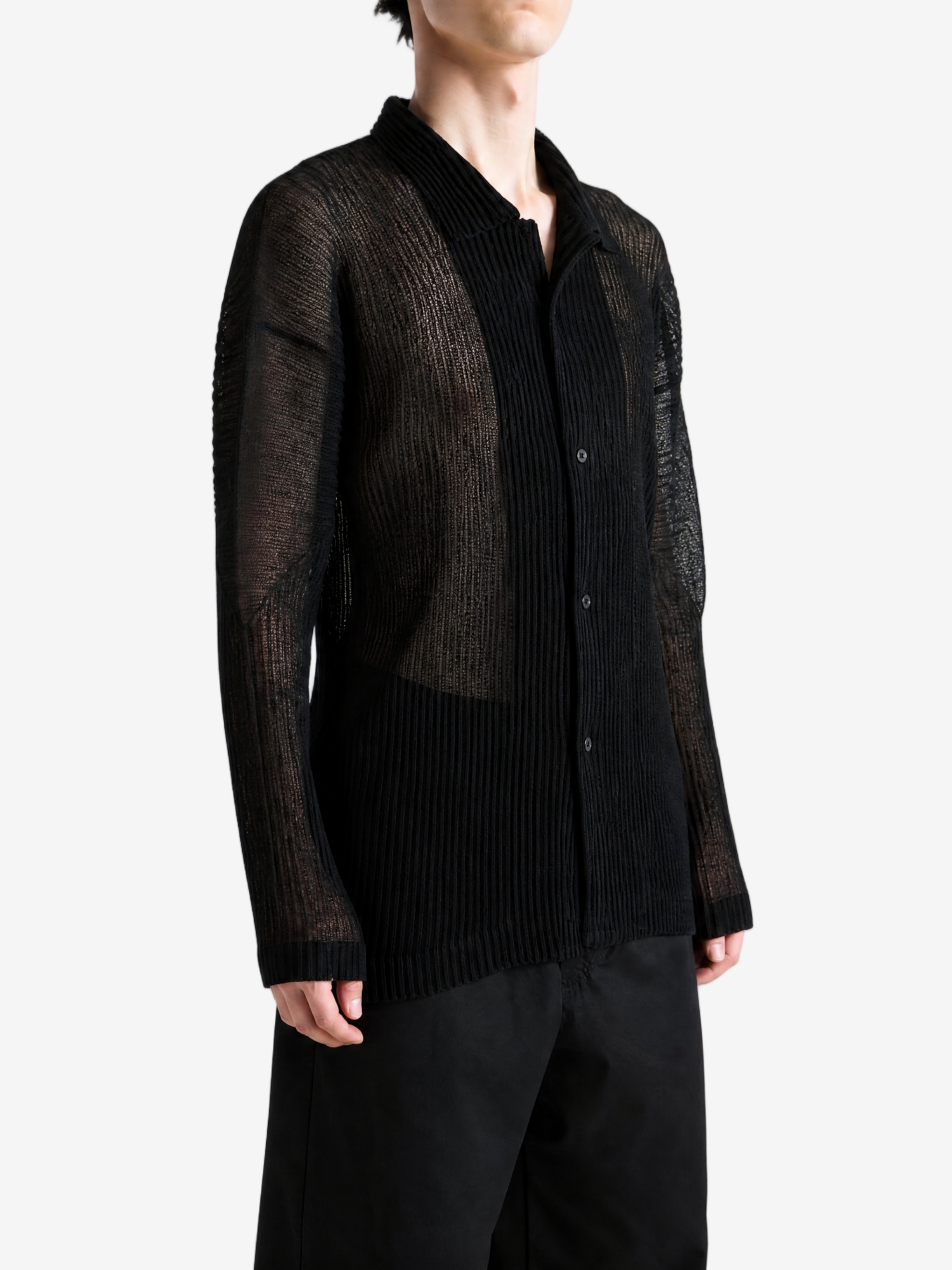 Black shirt worn by a person, showing the shirt fit
