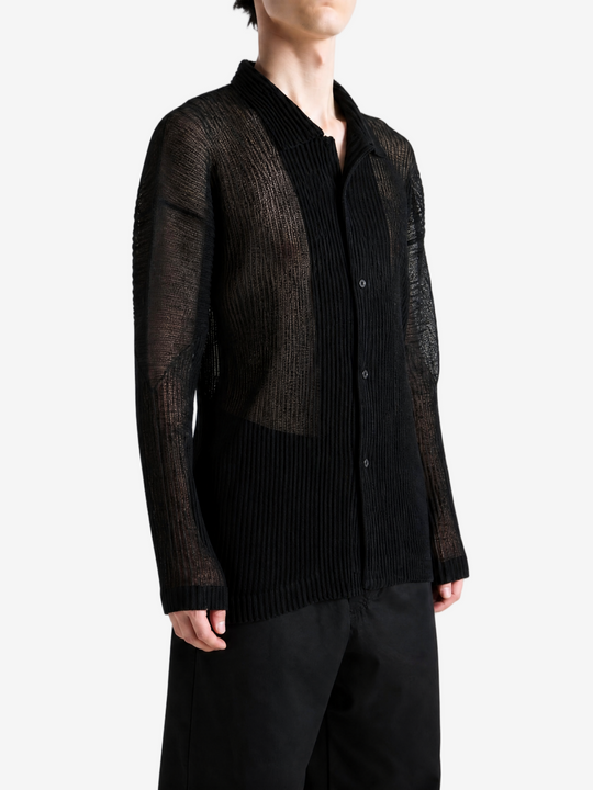 Black shirt worn by a person, showing the shirt fit