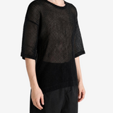 Black t-shirt worn by a person, showing the t-shirt fit