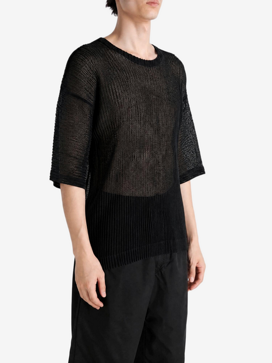 Black t-shirt worn by a person, showing the t-shirt fit