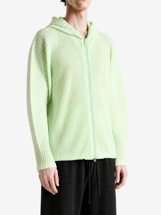 Green jacket worn by a person, showing the jacket fit