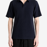 Navy shirt worn by a person, showing the shirt fit