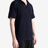 Navy shirt worn by a person, showing the shirt fit