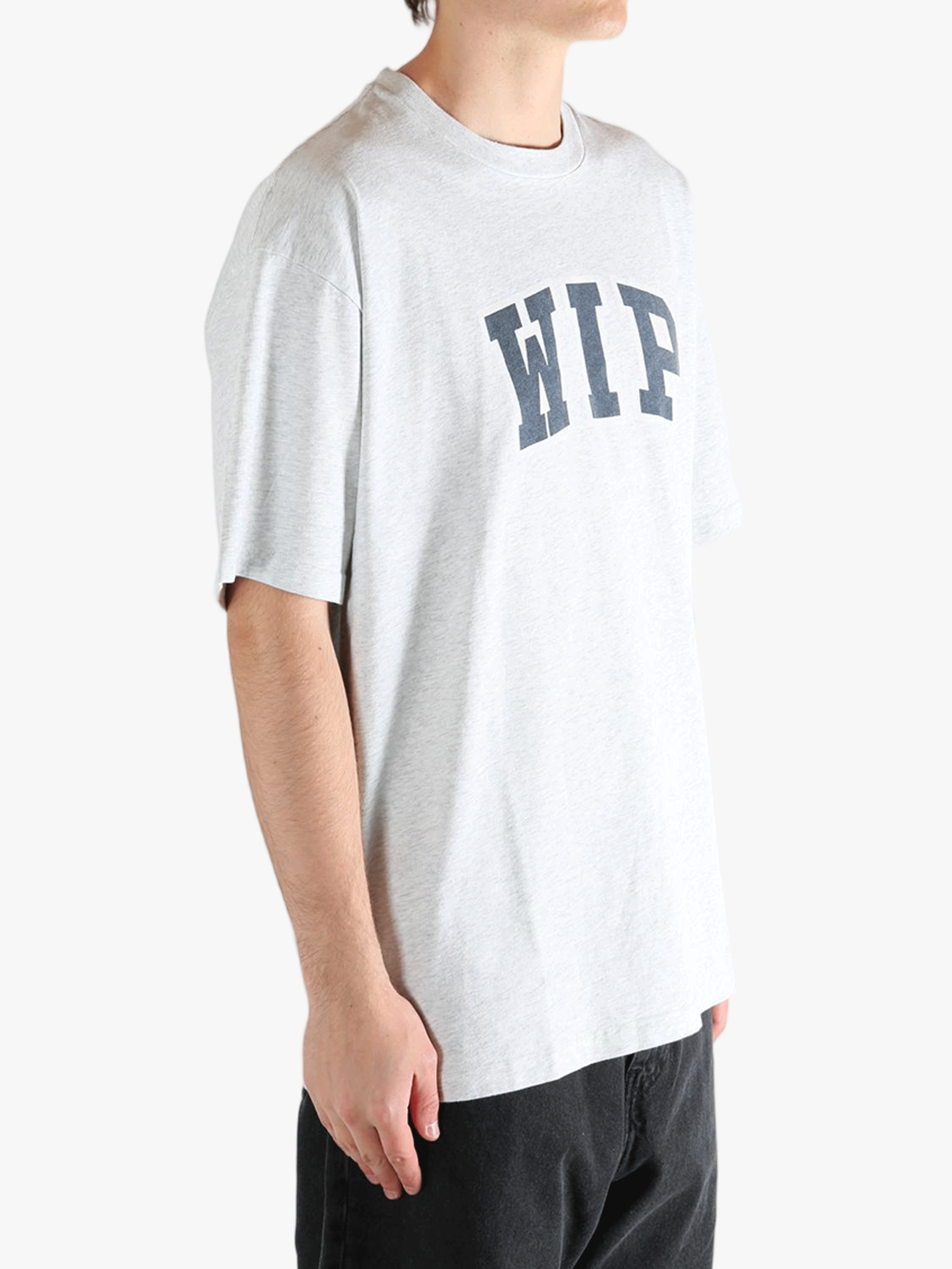 Grey t-shirt worn by a person, showing the t-shirt's fit