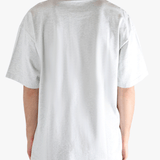 Grey t-shirt worn by a person, showing the t-shirt's fit