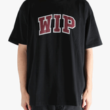 Black t-shirt worn by a person, showing the t-shirt's fit