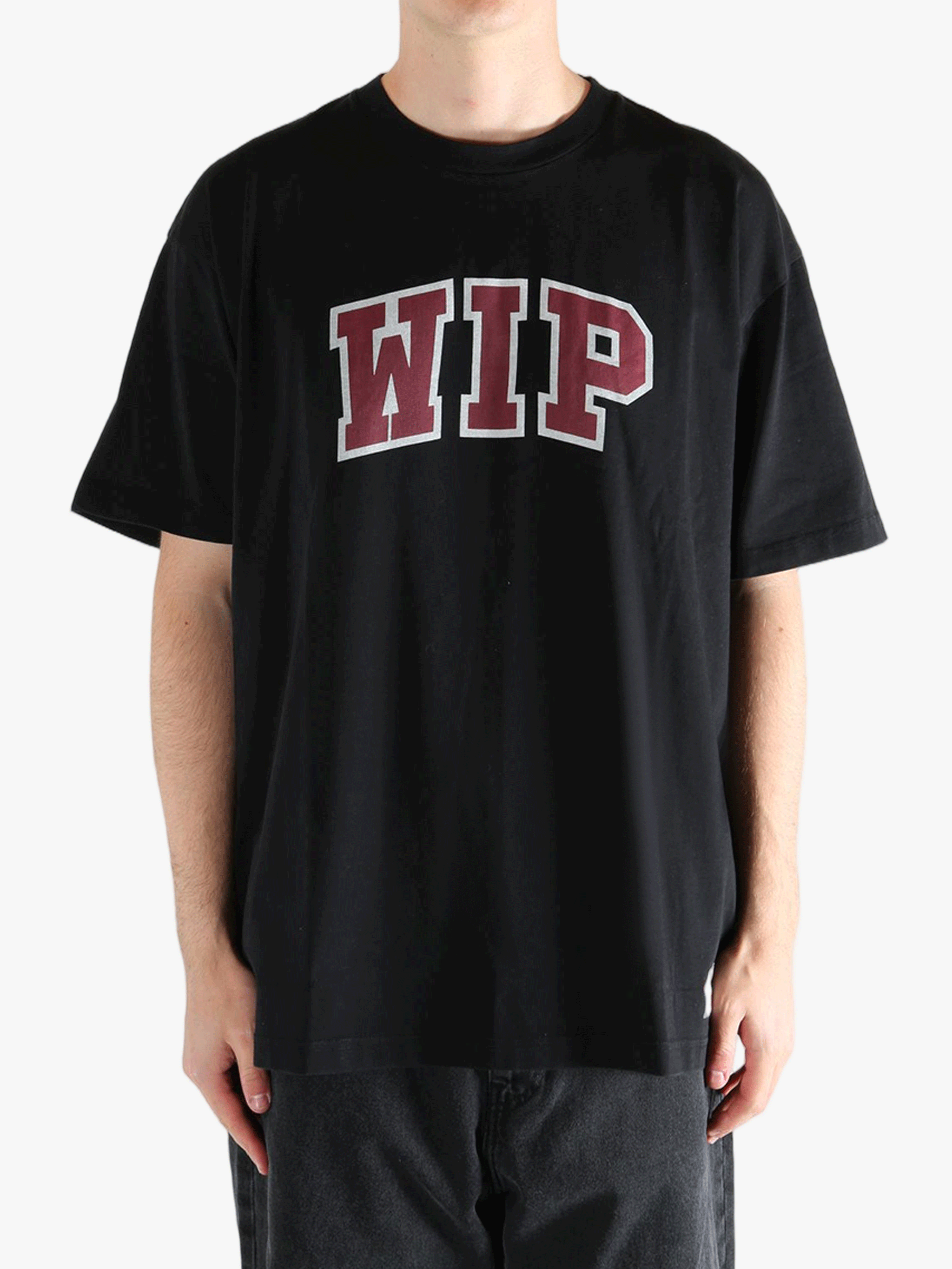 Black t-shirt worn by a person, showing the t-shirt's fit