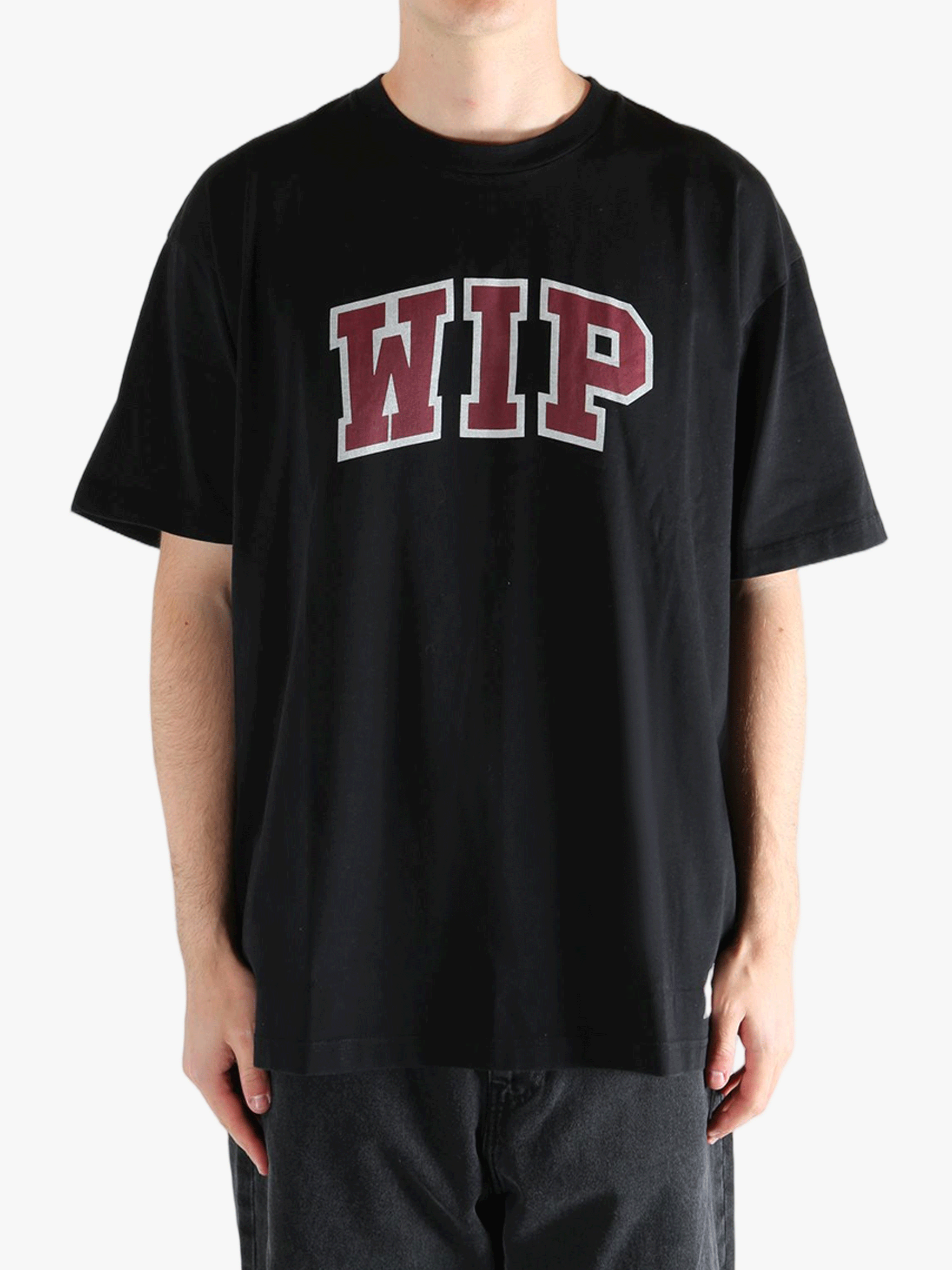 Black t-shirt worn by a person, showing the t-shirt's fit