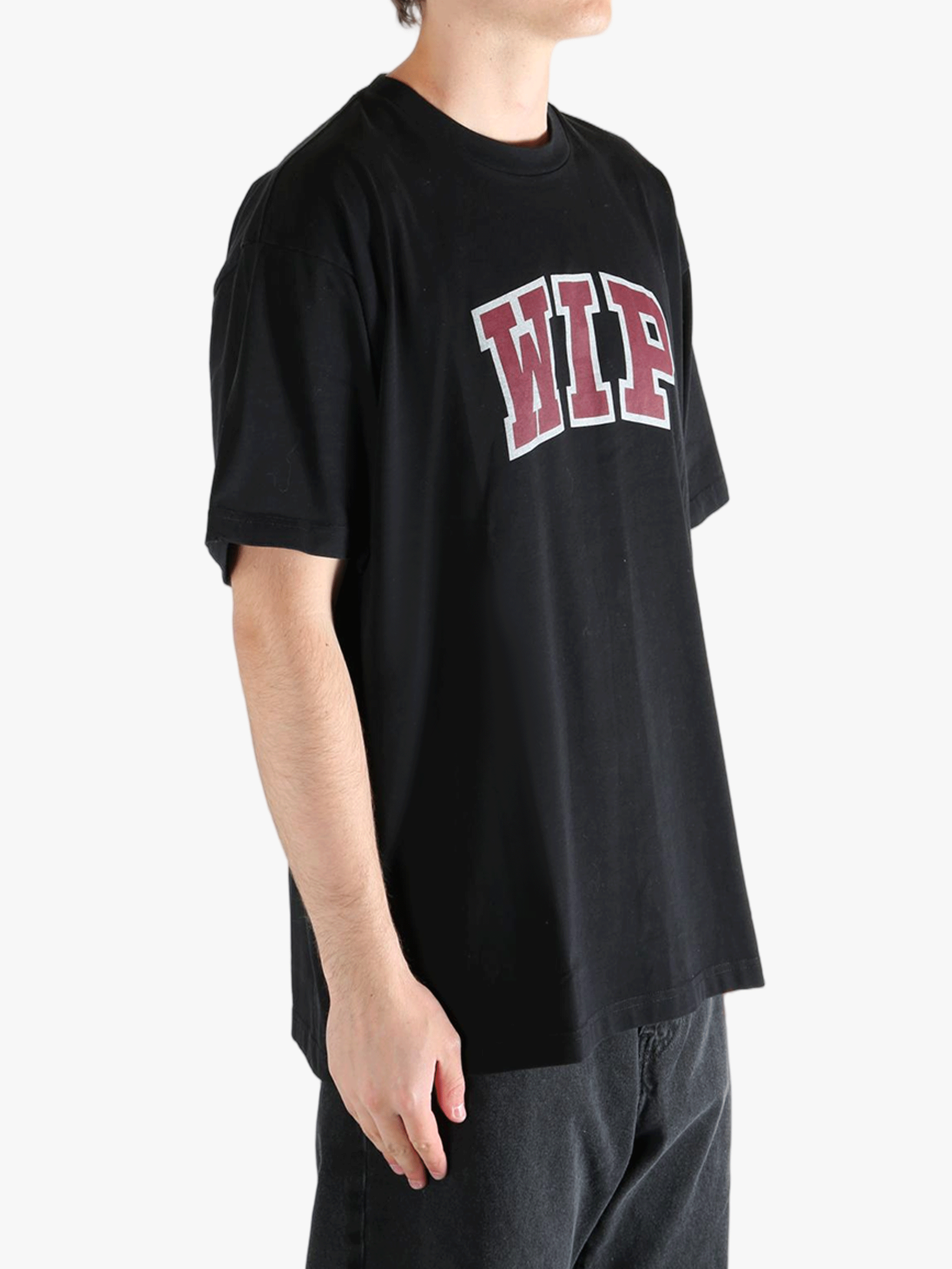 Black t-shirt worn by a person, showing the t-shirt's fit