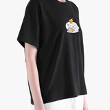 Black top worn by a person, showing the top fit