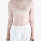 Pink shirt worn by a person, showing the shirt's fit
