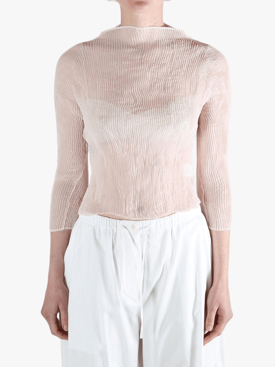 Pink shirt worn by a person, showing the shirt's fit
