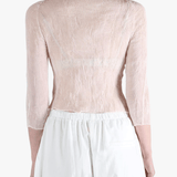 Pink shirt worn by a person, showing the shirt's fit