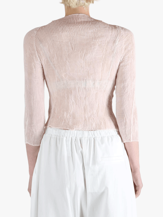 Pink shirt worn by a person, showing the shirt's fit