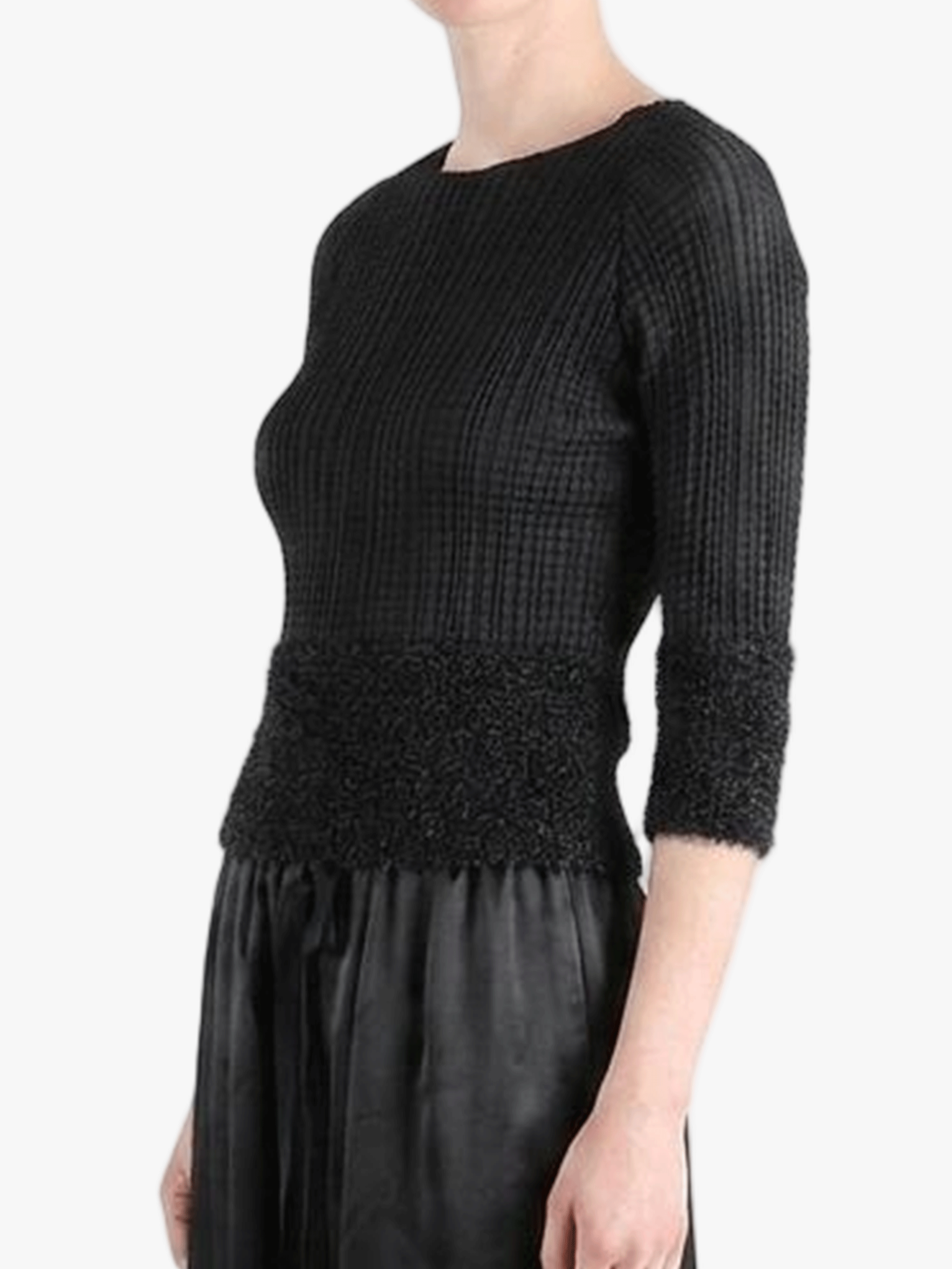 Black knitwear worn by a person,showing the knitwear fit