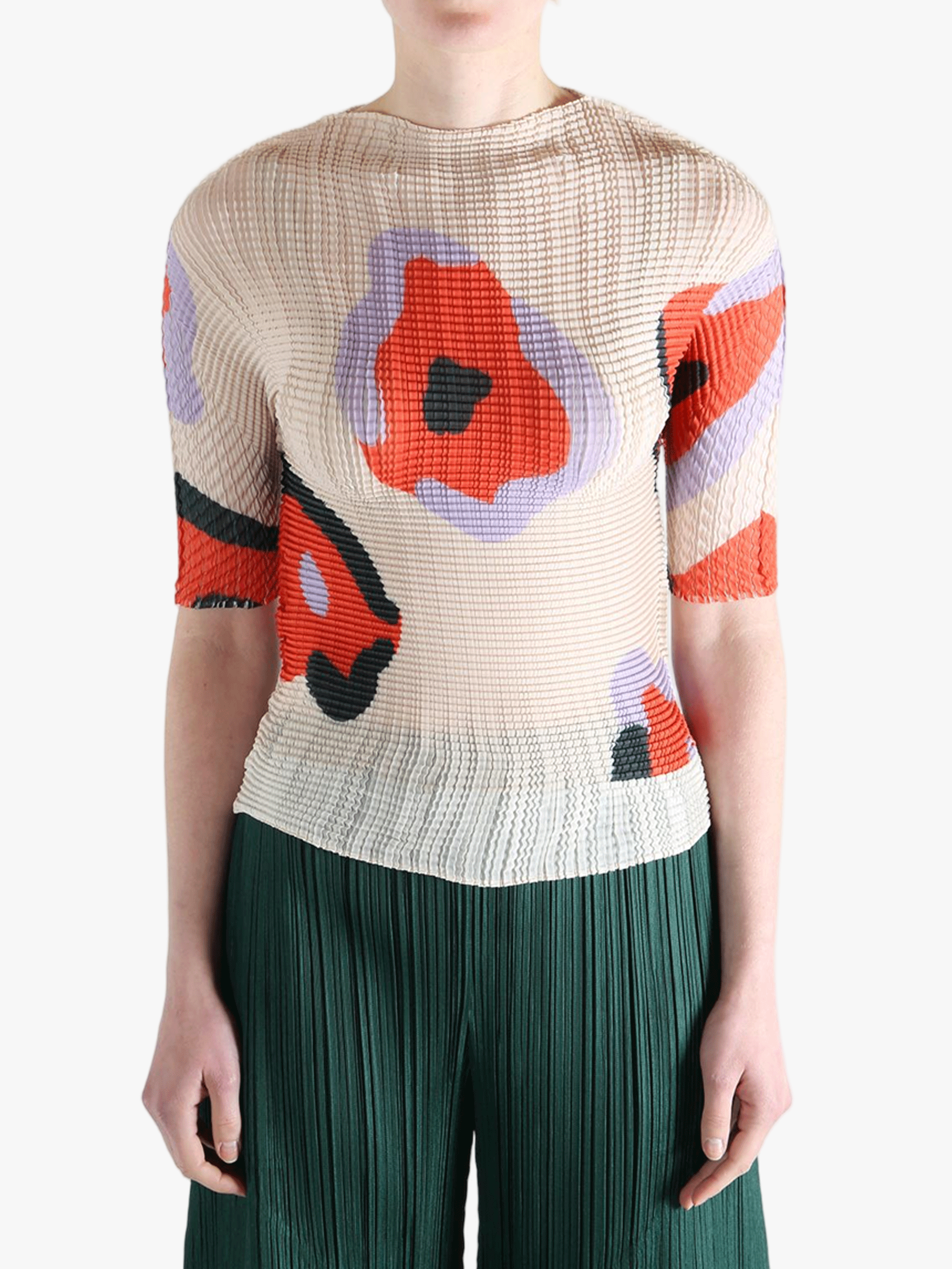 Tan shirt worn by a person, showing the shirt fit