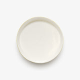 Top view of JINJIN PARIS Golden Rim Shallow Plate Medium in glazed ivory porcelain with circular silhouette and gold edging.