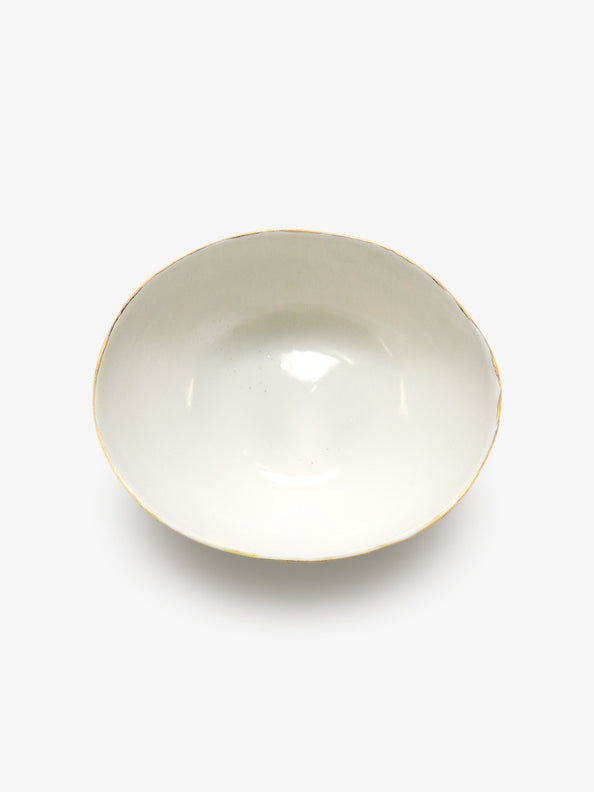 Top view of JINJIN PARIS Golden Rim Bowl Large in glazed ivory porcelain with asymmetrical circular shape and gold edging.