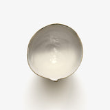 Top view of JINJIN PARIS Golden Rim Coffee Cup Medium with asymmetrical circular opening and glazed interior.