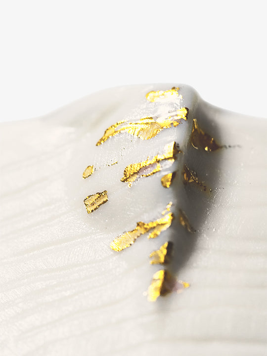 Detail of JINJIN PARIS Golden Rim Coffee Cup Medium with textured porcelain surface and gold leaf accents.