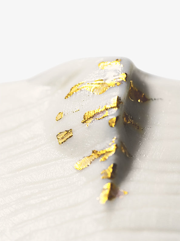 Detail of JINJIN PARIS Golden Rim Coffee Cup Medium with textured porcelain surface and gold leaf accents.