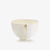 JINJIN PARIS Golden Rim Coffee Cup Medium in ivory porcelain, angled view with textured exterior and hand-finished gold rim.